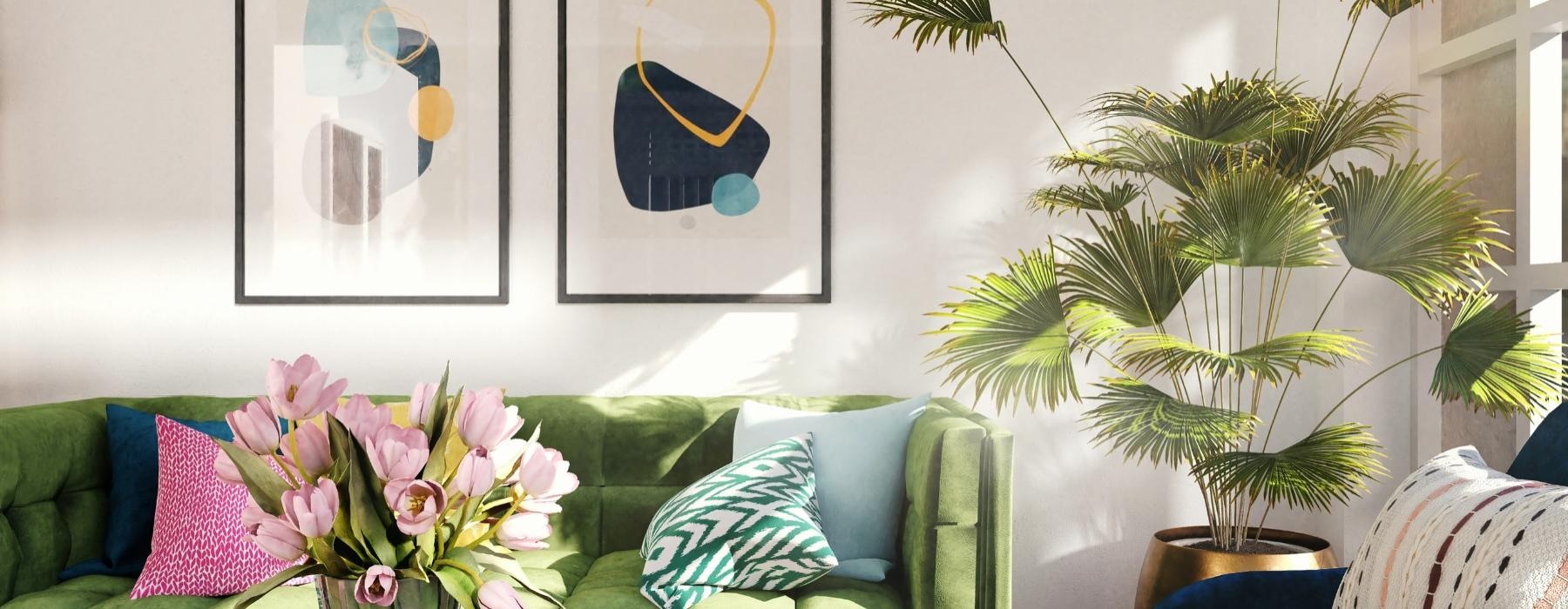 a living room with a green couch and a vase with flowers